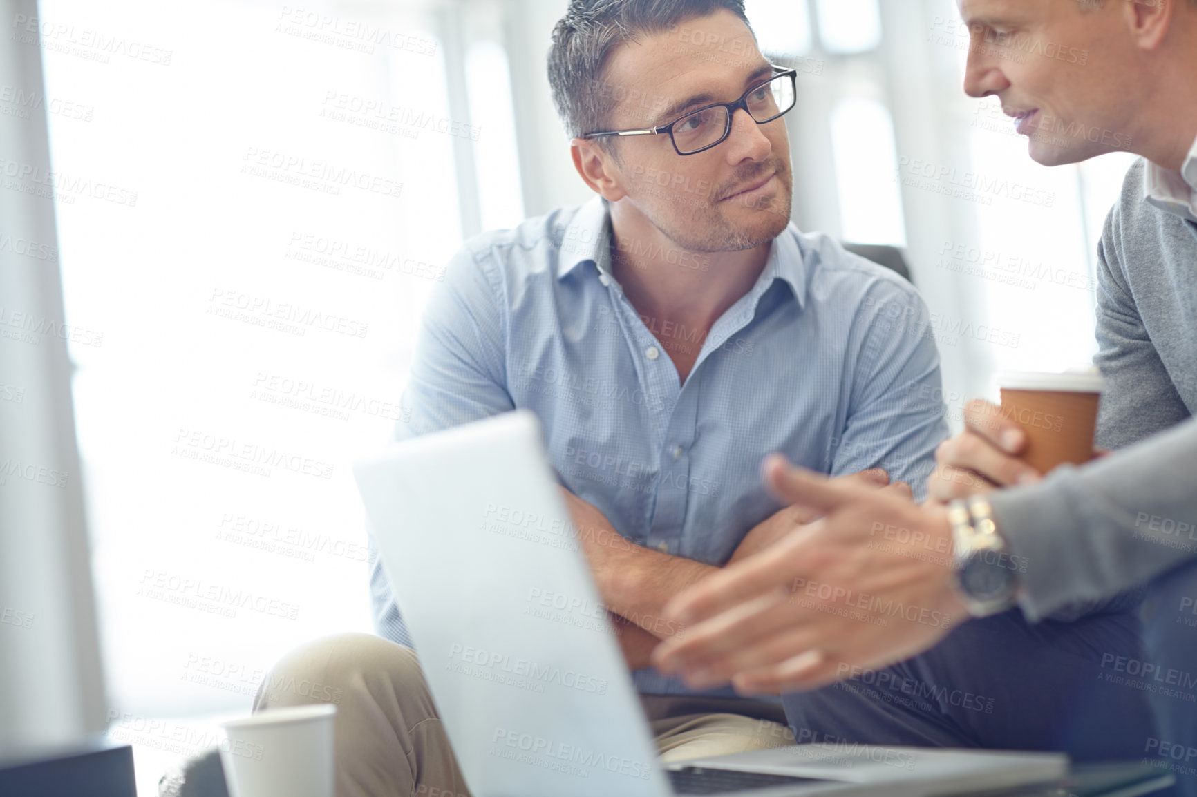 Buy stock photo Business man, laptop and team in discussion for deal, proposal or corporate idea at office. Business people talking, strategy or planning market strategy or advertising in conversation at workplace