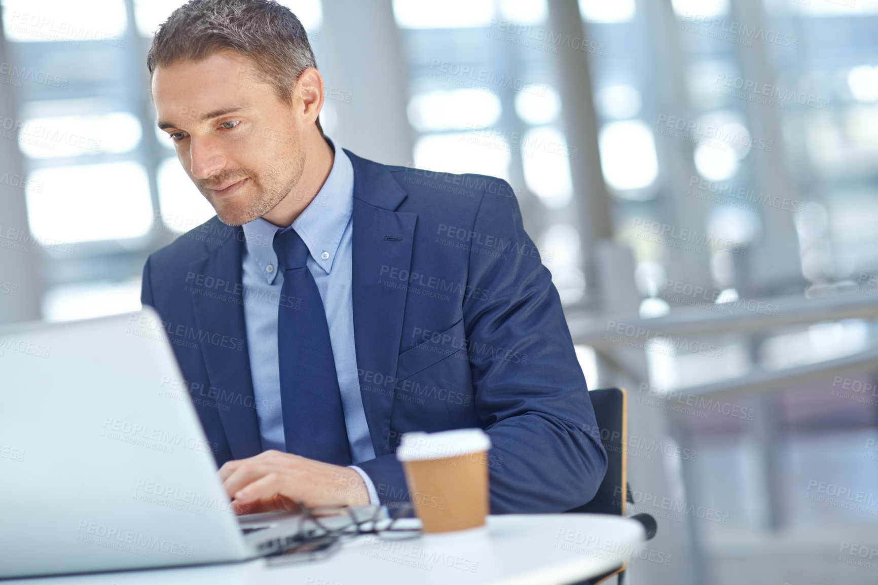 Buy stock photo Corporate, office and businessman working on a project or company report with a deadline on a laptop. Success, computer and professional male employee from Canada planning a proposal in the workplace