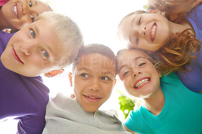 Buy stock photo Multi-ethnic group of smiling children in a huddle