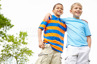 Buy stock photo Two little boys standing together and relaxing while outdoors