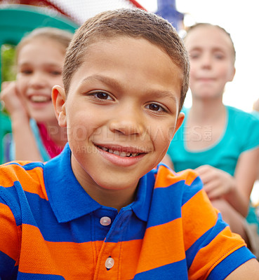 Buy stock photo A multi-ethnic group of happy children playing on a jungle gym in a play park