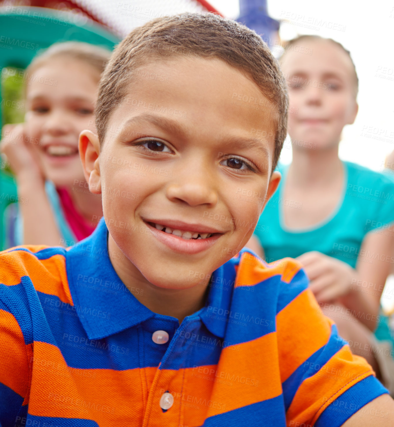 Buy stock photo A multi-ethnic group of happy children playing on a jungle gym in a play park