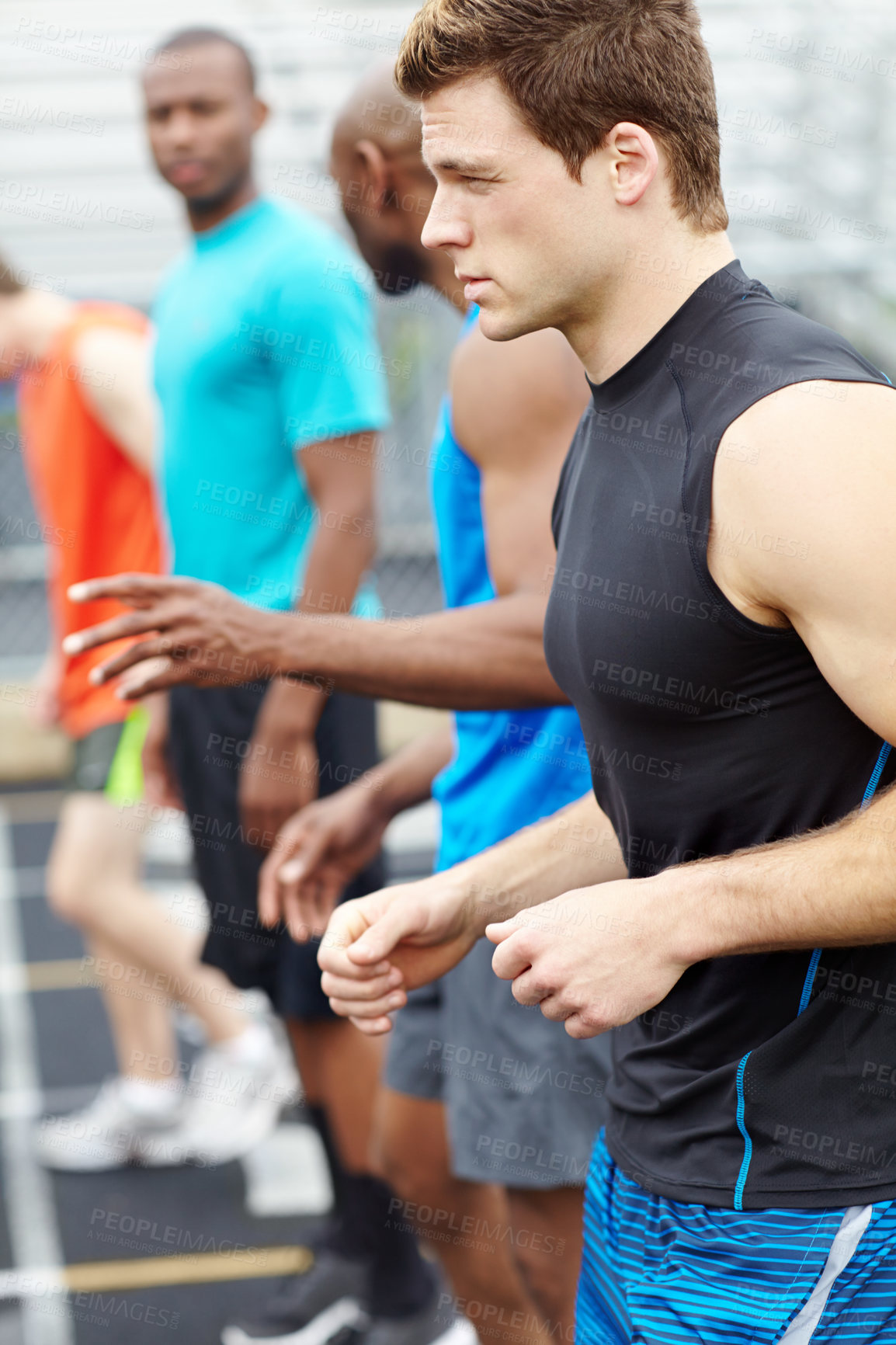 Buy stock photo Side view of a line up of runners at the beginning of the race