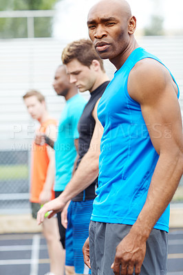 Buy stock photo Race, start and portrait of man in stadium for runner, sports athlete and competition practice. Training, workout and speed with people on track of arena for fitness, challenge and exercise event