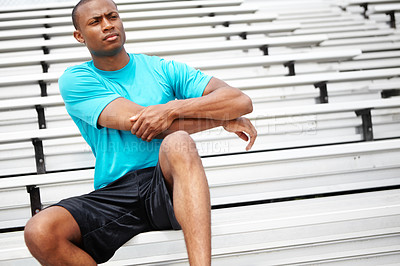 Buy stock photo Cropped shot of a male athlete cooling down on the rafters