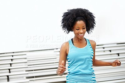 Buy stock photo Cropped shot of a female runner smiling while standing on the rafters