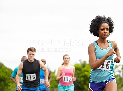Buy stock photo Cropped shot of a persistent female athlete running in first place