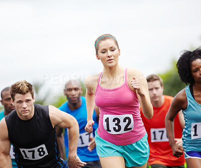 Buy stock photo Front view of a group of runners at the beginning of the race