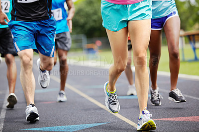Buy stock photo Cropped close up shot of athletes' legs during a race