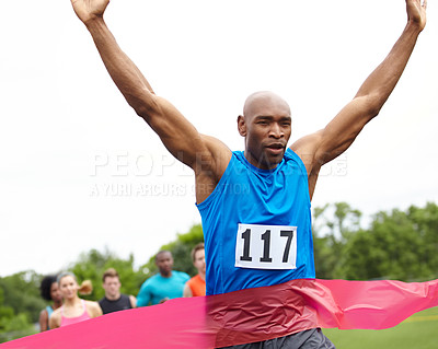 Buy stock photo Cropped shot of a winning athlete at the end of a race