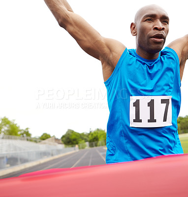 Buy stock photo Cropped close up of a victorious athlete reaching the end of the race