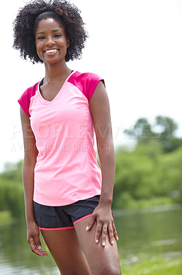 Buy stock photo Cropped portrait of a female athlete smiling widely and standing outdoors in a casual stance