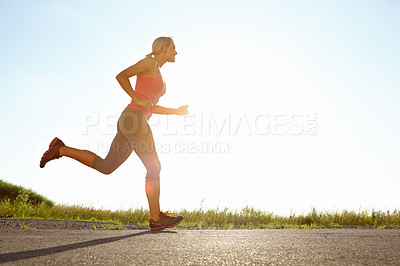 Buy stock photo A young woman running on a sunny day