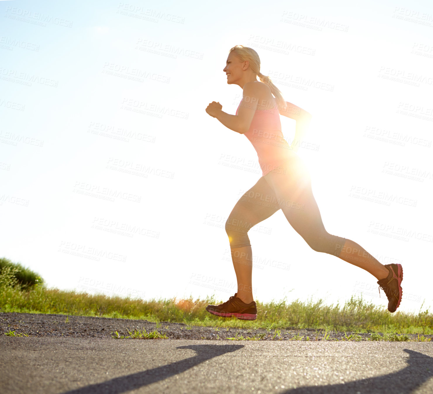 Buy stock photo A young woman running on a sunny day