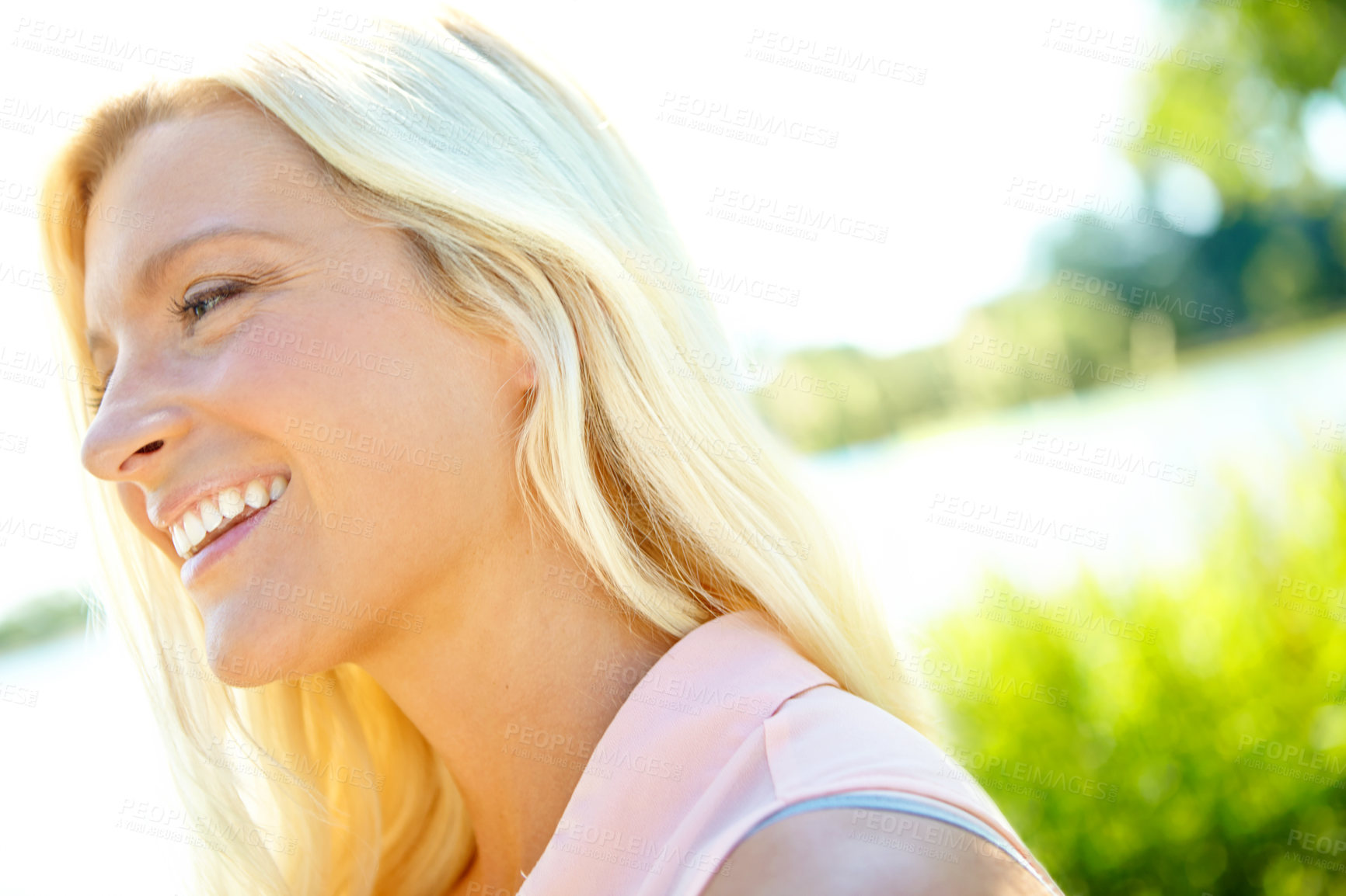 Buy stock photo Profile of a beautiful blonde outside with copyspace