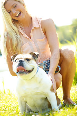 Buy stock photo Companion, laughing or love with woman and dog outdoor in park together for bonding, training or walk. Funny, health or vitality with bulldog and pet owner in nature for summer activity or exercise