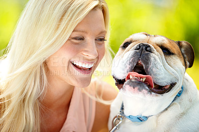 Buy stock photo Portrait of a happy dog with his owner looking at him lovingly and laughing