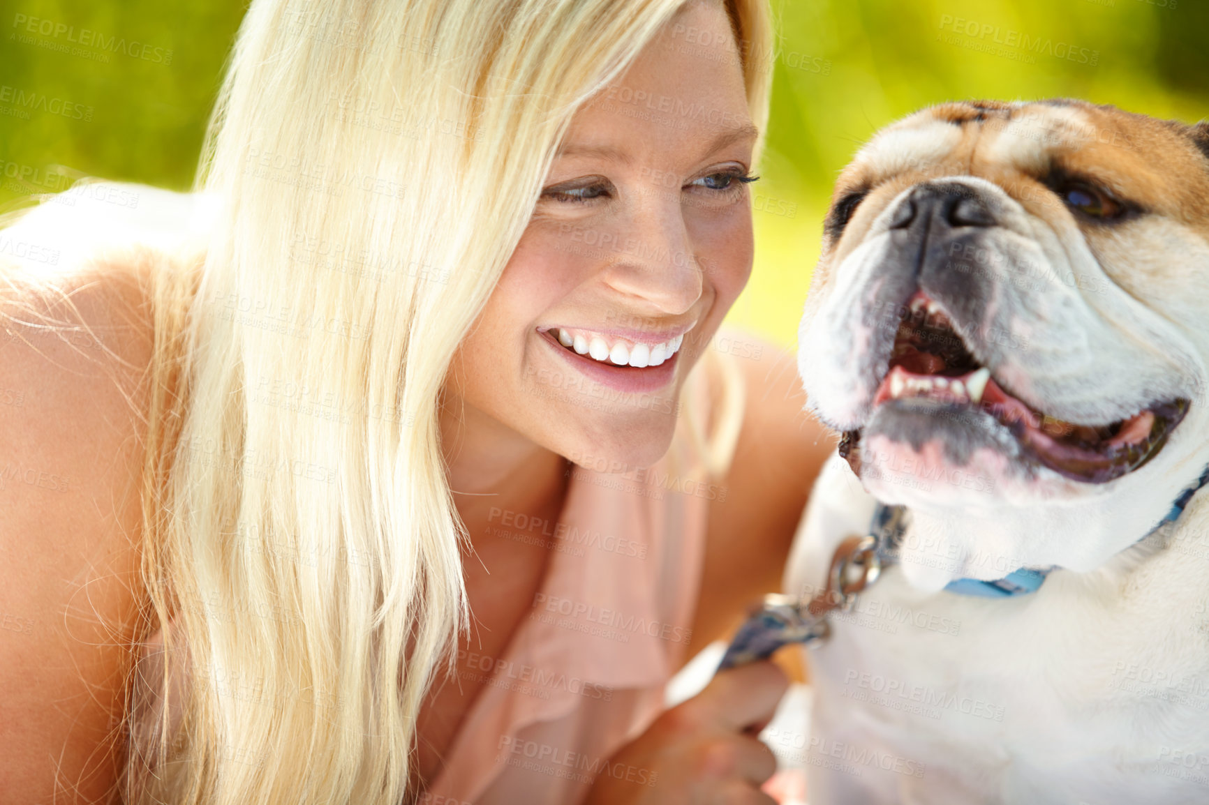 Buy stock photo Companion, friend and smile of woman with dog outdoor in park together for bonding, training or walk. Health, vitality or wellness with owner and pet bulldog in nature for summer activity or exercise