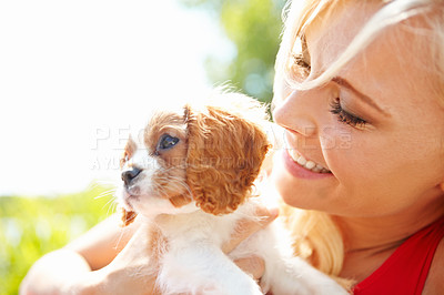 Buy stock photo Woman, smile and outdoor with dog for love, pet care and excited for adoption approval. Person, puppy companion and happy in park with support animal, new best friend and bonding for anxiety relief