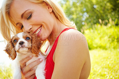 Buy stock photo Woman, smile and dog in park with hug, pet care and excited for adoption approval. Person, puppy companion and happiness in nature with support animal, new best friend and bonding for anxiety relief