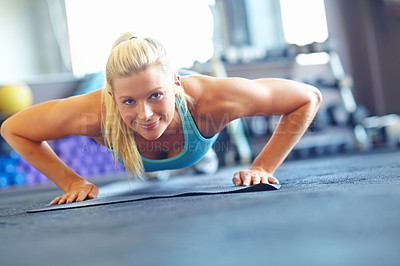 Buy stock photo Female athlete, push ups and core workout for sport, exercise or fitness to wellness with performance or commitment. Woman, plank and happiness in gym for training, strong muscle or toning at pilates