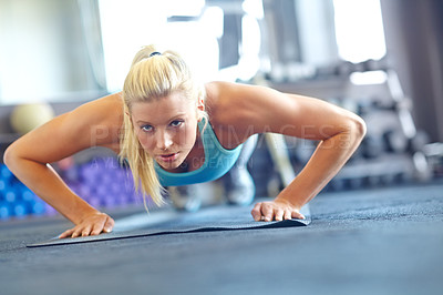 Buy stock photo Woman, push ups and serious for sports, exercise and fitness for workout with mat or balance. Female athlete, commitment and performance in gym for training, strong muscle and toned body for wellness