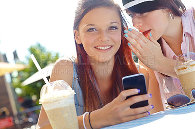 Buy stock photo Phone, picnic and rumor with teen friends drinking ice coffee outdoor in park together for break. App, secret and whisper with girls on blanket in nature for gossip or text message communication