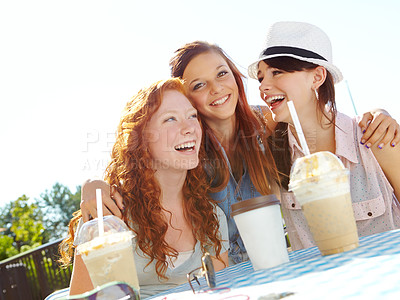 Buy stock photo A group of adolescent girls enjoying smoothies at an outdoor cafe