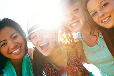 Buy stock photo Closeup shot of a group of teenage girls smiling with their arms around each other's shoulders