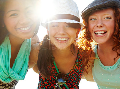 Buy stock photo Closeup shot of a group of teenage girls smiling with their arms around each other's shoulders