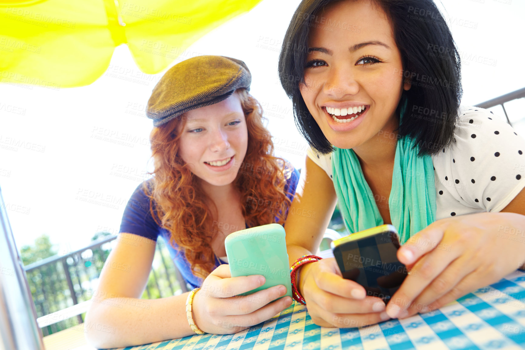 Buy stock photo Cellphone, outdoor and portrait of girl friends reading text for planning graduation trip together in group chat. Happy, phone and teens in park with travel blog for holiday advice, tips or guidance.