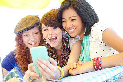 Buy stock photo Friends, cafe and smartphone with laugh, reading together and comic meme on social media app. Happy women, phone and group of girls with funny video, joke or web blog for outdoor summer travel