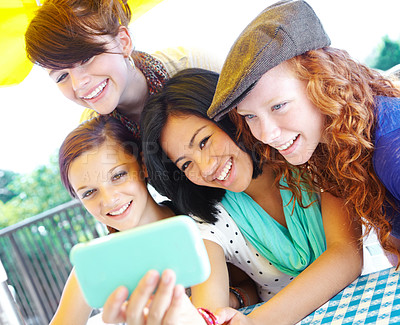 Buy stock photo A group of adolescent girls taking a self-portrait with a smartphone camera