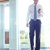 Taking a quick call | Buy Stock Photo on PeopleImages, Picture And ...