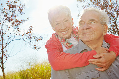 Buy stock photo A senior couple relaxing outside on a sunny day