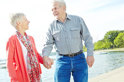 Buy stock photo A mature couple enjoying a day by the lake