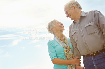 Buy stock photo Cropped image of a mature couple looking at each other with copyspace