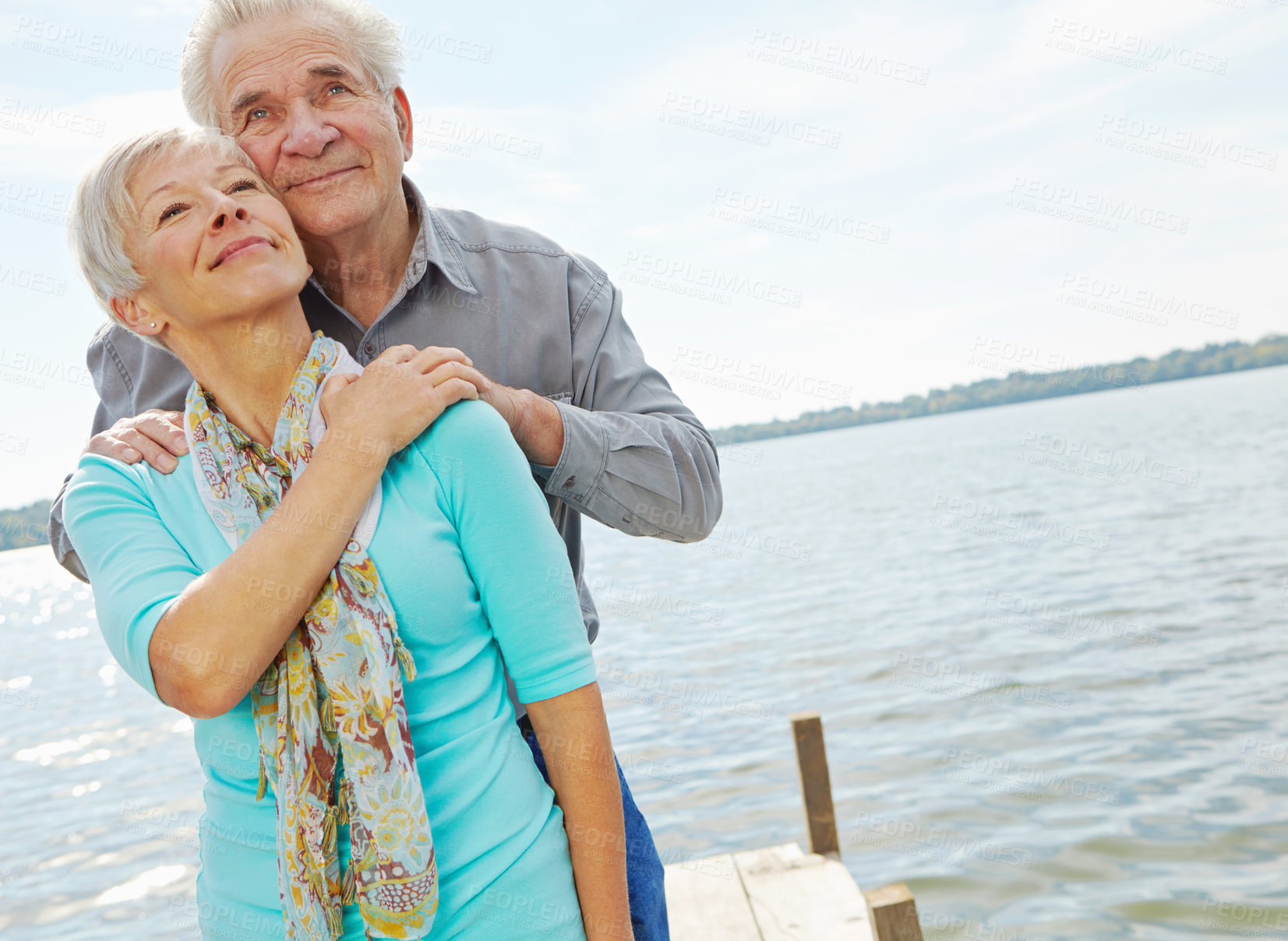 Buy stock photo Love, travel and elderly couple at lake on holiday, relationship and connection for loyalty. Vacation, happy man and woman by water pier outdoor for support, view and think of marriage in retirement