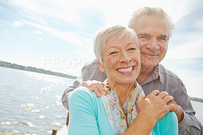 Buy stock photo Portrait, vacation and elderly couple at lake for love, holiday and relax together. Retirement, happy man and woman by water jetty outdoor for support, travel and romance in marriage in Australia