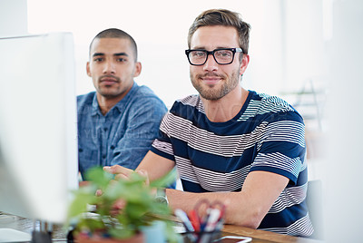 Buy stock photo Portrait of two male designers working together at a computer