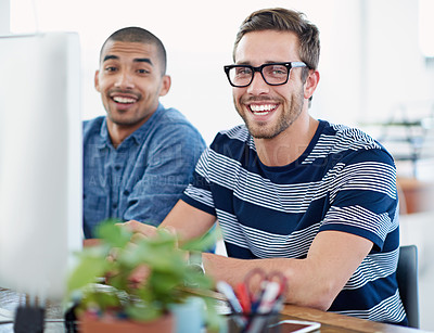 Buy stock photo Portrait of two male designers working together at a computer