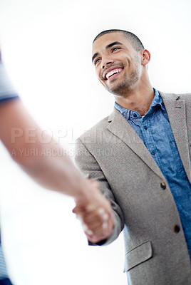 Buy stock photo Shot of a businessman shaking hands with an unrecognizable person