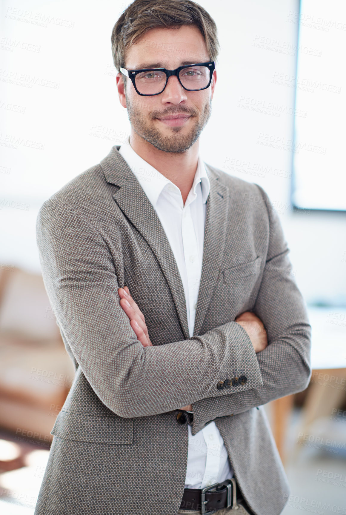 Buy stock photo Portrait of a handsome young businessman in his office