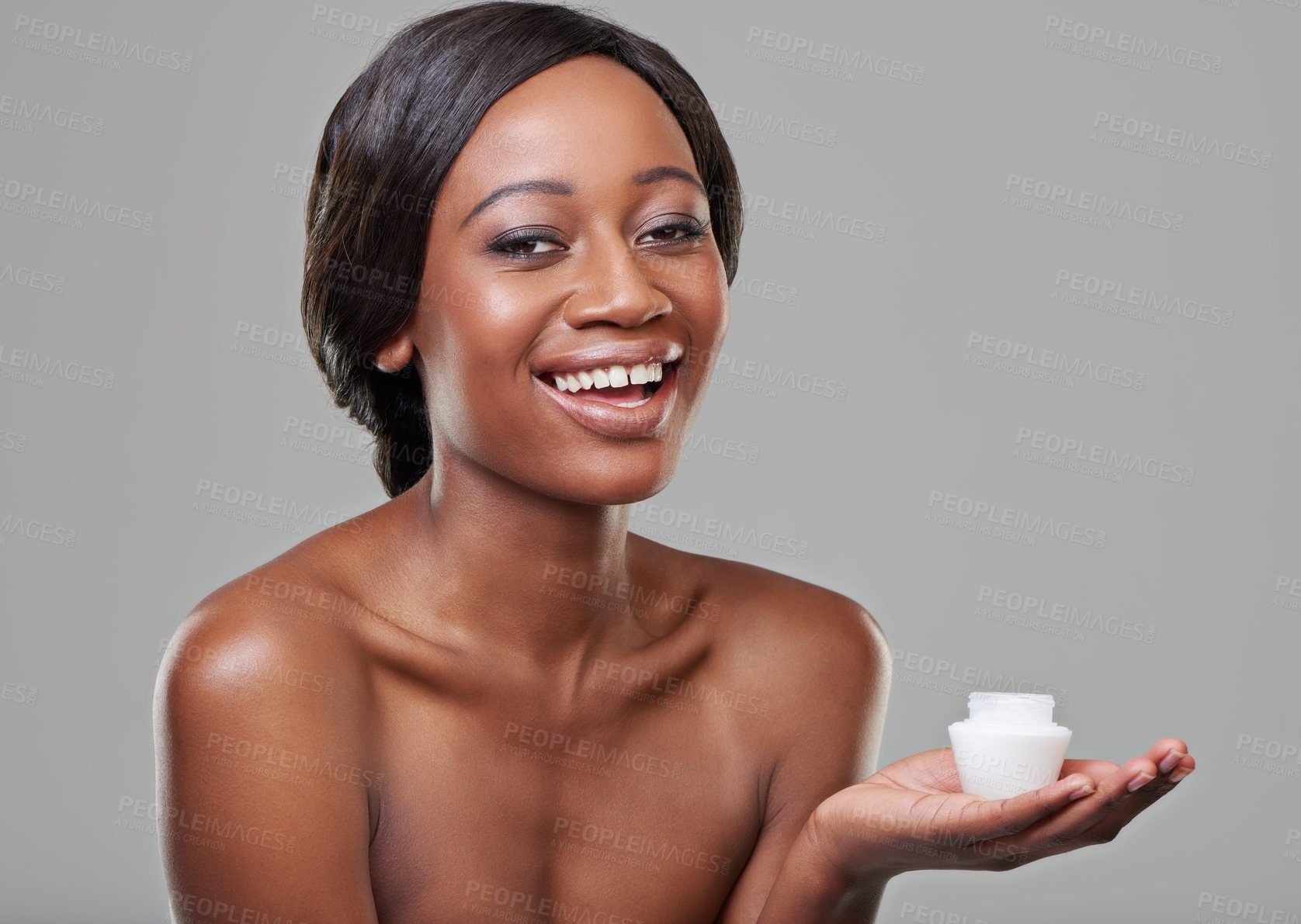 Buy stock photo Woman, skin cream and jar in studio portrait for product, cosmetics or change by gray background. Girl, model and African person with smile for beauty, skincare or serum in container for facial glow