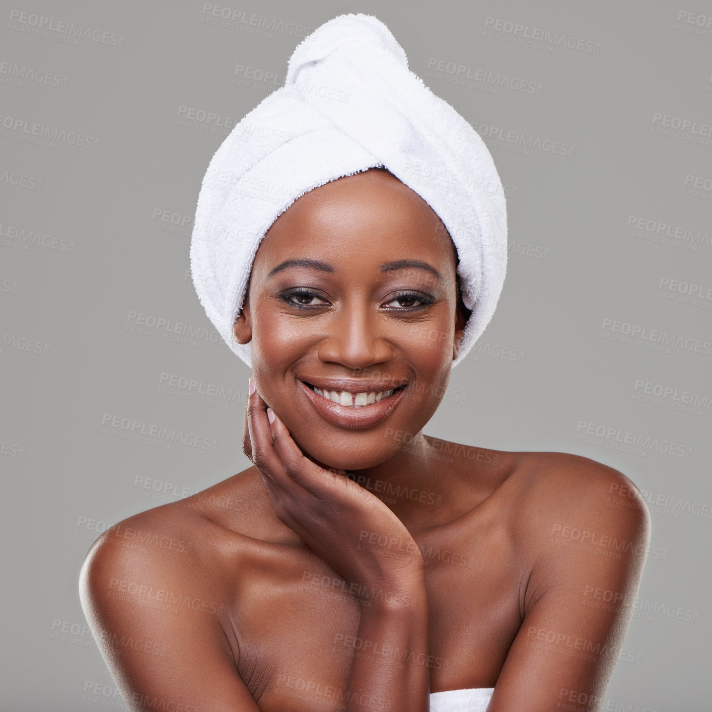 Buy stock photo Woman, portrait and towel in studio for skincare cleaning or healthy transformation, shower or grey background. Black person, face and smile for morning routine with dermatology, hygiene or mockup