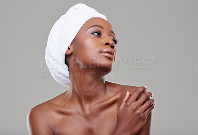 Buy stock photo Black woman, glow and cosmetics with dermatology, shine and healthy skin on white studio background. Glow, African person and model with wellness and towel with makeup, spa treatment and aesthetic