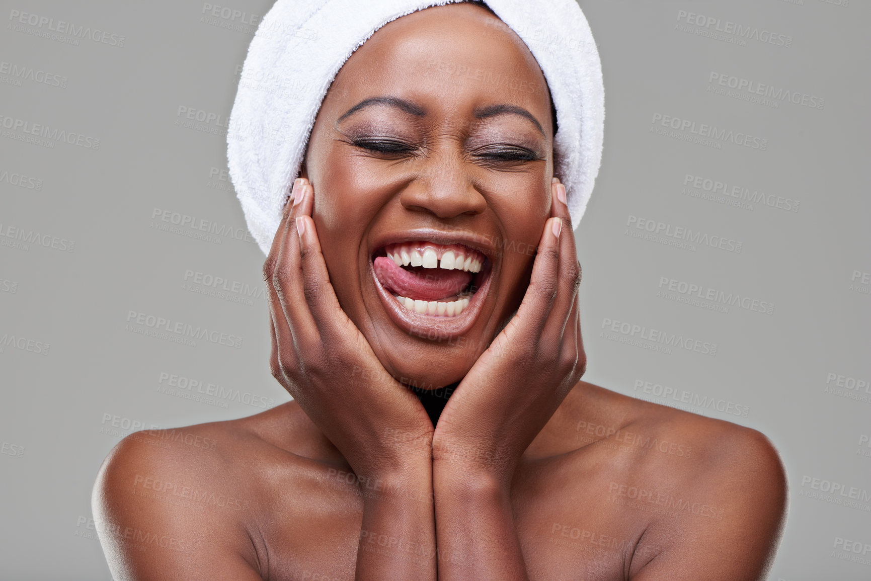 Buy stock photo Hands, silly or tongue out of black woman for beauty, skin care or cosmetics with eyes closed isolated on gray background. Female person, funny face or closeup of lady for cleansing, spa or treatment