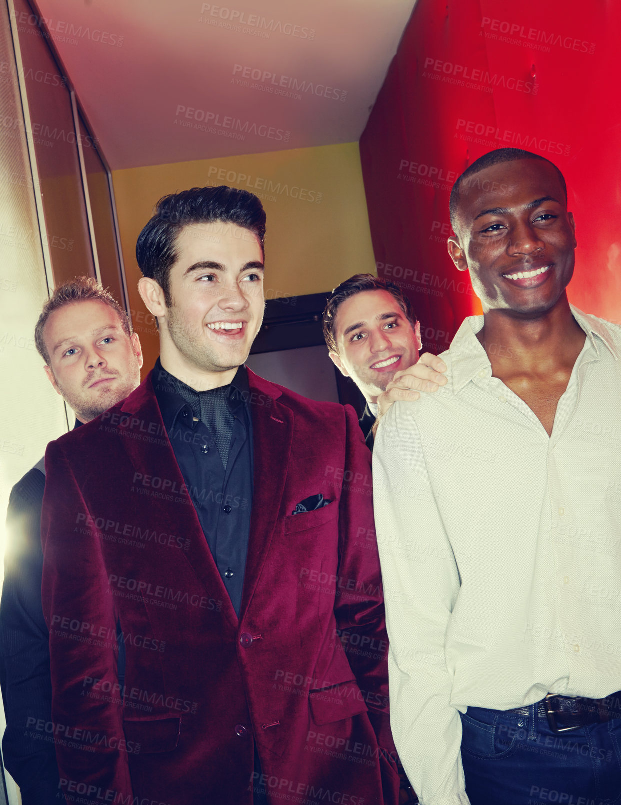 Buy stock photo A group of smartly dressed men arriving at a nightclub together