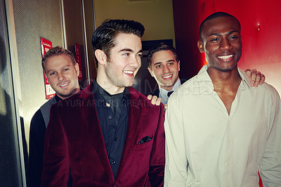 Buy stock photo A group of smartly dressed men arriving at a nightclub together