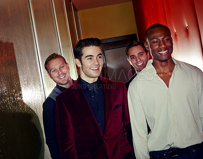 Buy stock photo A group of smartly dressed men arriving at a nightclub together